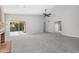 Living room with fireplace, sliding glass doors, and ceiling fan at 2164 S Catarina --, Mesa, AZ 85202