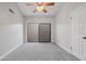 Bright bedroom with sliding glass door to patio and ceiling fan at 2164 S Catarina --, Mesa, AZ 85202