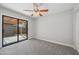Bedroom with sliding glass door to backyard at 2164 S Catarina --, Mesa, AZ 85202