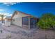 Home exterior with a screened patio and landscaping at 1449 Leisure World --, Mesa, AZ 85206