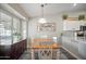 Dining area with a wooden table and white chairs at 1440 E La Costa Dr, Chandler, AZ 85249