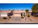 Single story home with a two car garage and desert landscaping at 1440 E La Costa Dr, Chandler, AZ 85249