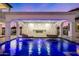 Relaxing pool area with hanging daybeds under a water feature at 1480 E Raven Ct, Gilbert, AZ 85297
