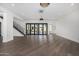 Spacious living area with hardwood floors, a staircase, and access to a patio at 1480 E Raven Ct, Gilbert, AZ 85297