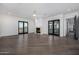 Large bedroom with hardwood floors, fireplace, and access to balcony at 1480 E Raven Ct, Gilbert, AZ 85297