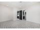 Spacious bedroom with patterned tile floor and access to bathroom at 1480 E Raven Ct, Gilbert, AZ 85297