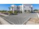 Luxury home with a paved driveway and desert landscaping at 1480 E Raven Ct, Gilbert, AZ 85297