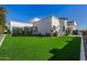 Artificial turf backyard with a modern home exterior at 1480 E Raven Ct, Gilbert, AZ 85297