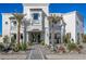 Luxury home exterior with palm trees and stone pathway at 1480 E Raven Ct, Gilbert, AZ 85297