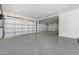 Large garage with epoxy flooring and double garage doors at 1480 E Raven Ct, Gilbert, AZ 85297