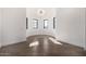Round bedroom with hardwood floors and three windows at 1480 E Raven Ct, Gilbert, AZ 85297