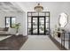 Spacious entryway with hardwood floors, large windows and a stylish console table at 1480 E Raven Ct, Gilbert, AZ 85297