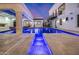 Night view of a luxury pool and patio with water features at 1480 E Raven Ct, Gilbert, AZ 85297
