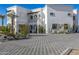 Luxury two-story home with a paved driveway and desert landscaping at 1480 E Raven Ct, Gilbert, AZ 85297