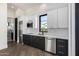 Modern kitchen with stainless steel appliances and white cabinets at 1480 E Raven Ct, Gilbert, AZ 85297