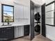 Convenient laundry room with stackable washer and dryer at 1480 E Raven Ct, Gilbert, AZ 85297
