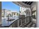 Modern outdoor kitchen with a built-in grill and checkered floor at 1480 E Raven Ct, Gilbert, AZ 85297