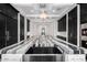 Luxurious kitchen boasts a large marble island, high-end appliances, and sleek dark cabinetry at 1480 E Raven Ct, Gilbert, AZ 85297