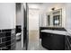 Modern black and white bathroom with a floating vanity at 1480 E Raven Ct, Gilbert, AZ 85297