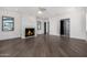 Bright living room with fireplace and hardwood floors at 1480 E Raven Ct, Gilbert, AZ 85297