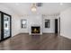 Bright living room with fireplace and hardwood floors at 1480 E Raven Ct, Gilbert, AZ 85297