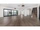 Spacious living area with hardwood floors, fireplace, and sliding doors leading to patio at 1480 E Raven Ct, Gilbert, AZ 85297