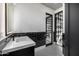 Stylish bathroom with black and white tile and a modern vanity at 1480 E Raven Ct, Gilbert, AZ 85297