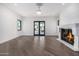 Bright living room with fireplace and hardwood floors at 1480 E Raven Ct, Gilbert, AZ 85297