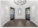 Round room with hardwood floors and french doors opening to a balcony at 1480 E Raven Ct, Gilbert, AZ 85297