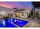 Stunning pool and spa with a spiral staircase and hanging daybeds at 1480 E Raven Ct, Gilbert, AZ 85297