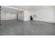 Spacious garage with epoxy flooring and ample storage at 1480 E Raven Ct, Gilbert, AZ 85297