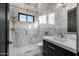Elegant bathroom with marble tile, a frameless glass shower, and modern fixtures at 1480 E Raven Ct, Gilbert, AZ 85297