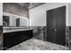 Bathroom with double vanity, marble, and black doors at 1480 E Raven Ct, Gilbert, AZ 85297
