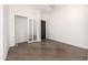 Spacious bedroom with hardwood floors and mirrored closet at 1480 E Raven Ct, Gilbert, AZ 85297