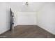 Bright bedroom featuring hardwood floors and an open door to another room at 1480 E Raven Ct, Gilbert, AZ 85297