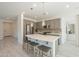 Modern kitchen with an island and stainless steel appliances at 767 E Cobble Stone Dr, Queen Creek, AZ 85140