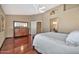 Spacious bedroom with hardwood floors and ceiling fan at 6782 W Firebird Dr, Glendale, AZ 85308