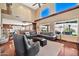 Bright living room with high ceilings, hardwood floors, and large windows at 6782 W Firebird Dr, Glendale, AZ 85308
