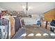 Two-car garage with ample storage space and shelving at 6782 W Firebird Dr, Glendale, AZ 85308