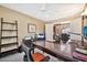 Home office with desk, shelving, and printer at 6782 W Firebird Dr, Glendale, AZ 85308