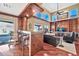 Spacious living room with hardwood floors, high ceilings, and a built-in entertainment center at 6782 W Firebird Dr, Glendale, AZ 85308