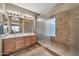 Elegant bathroom with dual sinks, large shower, and updated fixtures at 6782 W Firebird Dr, Glendale, AZ 85308
