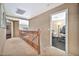 Upstairs hallway with access to bedrooms and home gym at 6782 W Firebird Dr, Glendale, AZ 85308