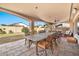 Large covered patio with a dining table and chairs at 6782 W Firebird Dr, Glendale, AZ 85308