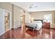 Bright bedroom featuring hardwood floors and ensuite bathroom access at 6782 W Firebird Dr, Glendale, AZ 85308