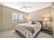 Comfortable bedroom with ceiling fan and neutral decor at 6782 W Firebird Dr, Glendale, AZ 85308
