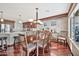 Bright dining room with hardwood floors and a large table at 6782 W Firebird Dr, Glendale, AZ 85308