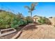 Landscaped backyard with patio and garden at 6782 W Firebird Dr, Glendale, AZ 85308