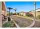 Landscaped backyard with patio and heater at 6782 W Firebird Dr, Glendale, AZ 85308