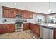 Modern kitchen with stainless steel appliances and an island at 6782 W Firebird Dr, Glendale, AZ 85308